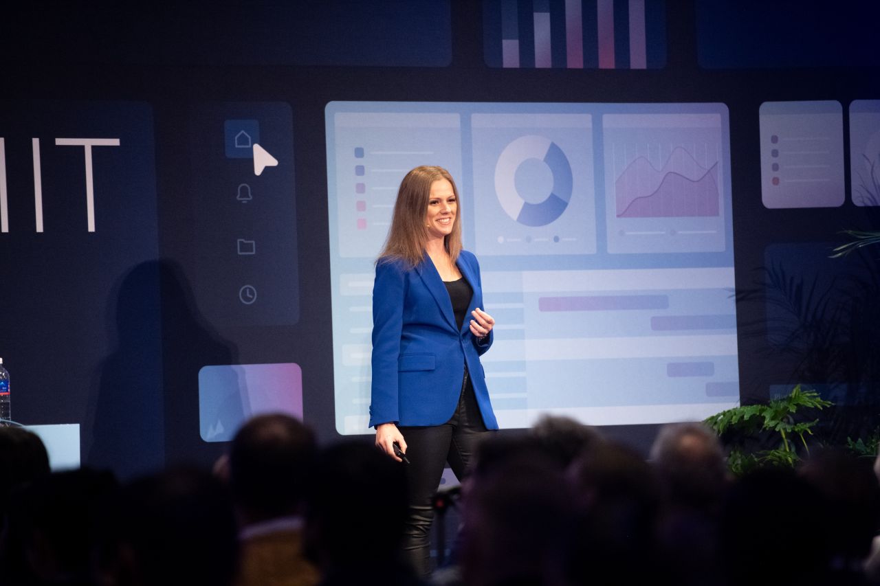 Rebecca Maklad presenting on stage